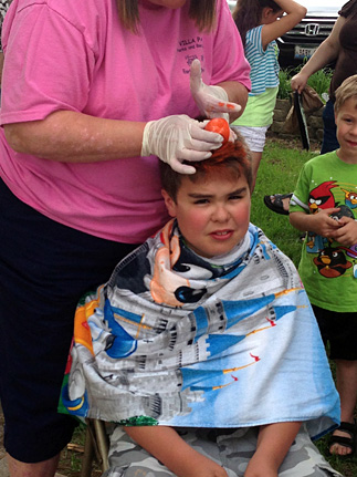 Child getting hair dyed